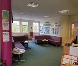 A bright and colourful waiting room with toys to play with