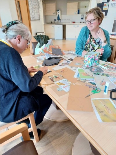 Image shows people working on artwork on the Laurel ward.