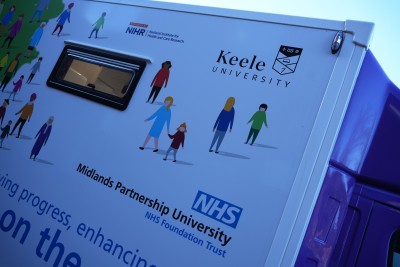 NIHR, Keele University and the MPFT logos on the side of the research bus