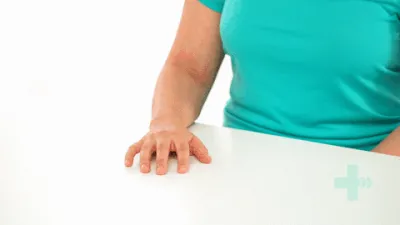 Finger extension stretch against a table.gif