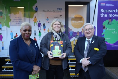 Neil Carr and Jackie Small stand with the donated AED