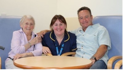 Nurse smiling with patients